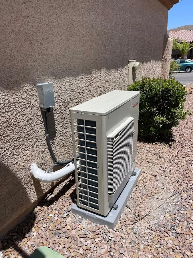 Residential air conditioning condenser unit in Tanaina